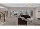 Spacious living area with leather sectional and lots of natural light at 102 Twilight Overlook, Canton, GA 30114