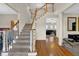 Grand staircase with wood railings and hardwood floors at 102 Twilight Overlook, Canton, GA 30114