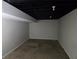 Empty, carpeted basement room ready for finishing at 2652 Winthrop Rd, Atlanta, GA 30337