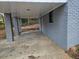 Carport with gray brick exterior and access to basement at 2652 Winthrop Rd, Atlanta, GA 30337