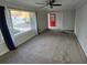 Bright living room featuring large windows and red door at 2652 Winthrop Rd, Atlanta, GA 30337
