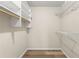 Spacious walk-in closet with built-in shelving and clothes rods at 4053 Cooper Ridge Se Ct, Smyrna, GA 30080