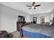 Primary bedroom with a rustic wooden bed frame and a wall-mounted TV at 4289 Brighton Nw Way, Kennesaw, GA 30144