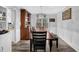 Elegant dining room with a large table, stylish light fixture, and built-in cabinetry at 4289 Brighton Nw Way, Kennesaw, GA 30144