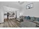 Spacious living room featuring wood-look flooring, open to the kitchen, and high ceilings at 4289 Brighton Nw Way, Kennesaw, GA 30144