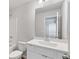 Clean bathroom with white vanity, single sink, and a large mirror at 6949 Melody Dr, Buford, GA 30518