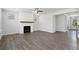 Spacious living room with hardwood floors and fireplace at 6949 Melody Dr, Buford, GA 30518