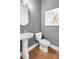 Powder room or half-bath with pedestal sink and modern fixtures at 6101 Marigold Way, Atlanta, GA 30349