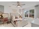 Cozy bedroom with natural light, ceiling fan, desk, and comfortable bed at 6101 Marigold Way, Atlanta, GA 30349