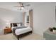 Bedroom with horizontal white shiplap, window and a ceiling fan at 6101 Marigold Way, Atlanta, GA 30349