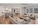 Open concept living room and kitchen area with lots of natural light and hardwood floors at 6101 Marigold Way, Atlanta, GA 30349