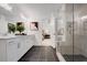 Spacious main bathroom with dual vanity sinks, glass shower, and tile flooring at 6101 Marigold Way, Atlanta, GA 30349