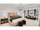 Elegant primary bedroom with a sitting area, large windows, and modern chandelier at 6101 Marigold Way, Atlanta, GA 30349