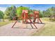 Community playground with swings and climbing structure at 2410 Emerald Dr, Loganville, GA 30052