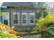 Wooden swing on the patio in a garden setting at 2410 Emerald Dr, Loganville, GA 30052