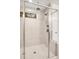 Large walk in shower featuring a rain shower head and a bench at 6097 Marigold Way, Atlanta, GA 30349