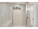 Spacious shower with tile surround, built-in bench, and dual shower heads at 6097 Marigold Way, Atlanta, GA 30349
