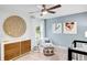 Whimsical Bedroom featuring cute animal prints, a crib, and stylish decor at 6097 Marigold Way, Atlanta, GA 30349