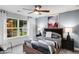 Stylish bedroom with geometric patterned bedspread and natural light from windows at 6097 Marigold Way, Atlanta, GA 30349