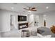 Upstairs loft area with sectional sofa, entertainment center, and laundry room access at 6097 Marigold Way, Atlanta, GA 30349