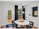 Dining area with access to a back deck through glass doors at 6097 Marigold Way, Atlanta, GA 30349