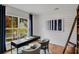 Dedicated home office space with large windows, a desk, and shiplap walls at 6097 Marigold Way, Atlanta, GA 30349