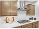 Stylish kitchen with stainless steel gas range, white countertops, and herringbone backsplash at 6097 Marigold Way, Atlanta, GA 30349