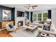Cozy living room with a fireplace, large windows, and comfortable seating at 6097 Marigold Way, Atlanta, GA 30349