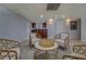 Open basement layout with wet bar, seating area, and neutral decor at 1103 Etowah Valley Ln, Woodstock, GA 30189