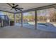 Covered patio with ceiling fan overlooking the backyard pool at 1103 Etowah Valley Ln, Woodstock, GA 30189