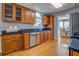 Spacious kitchen with oak cabinets, dark granite countertops, and stainless steel appliances at 1103 Etowah Valley Ln, Woodstock, GA 30189
