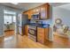 Kitchen with stainless steel appliances, wood cabinetry, and black countertops at 1103 Etowah Valley Ln, Woodstock, GA 30189