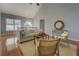 Living area with vaulted ceilings, wood floors, stylish furniture, and natural light at 1103 Etowah Valley Ln, Woodstock, GA 30189