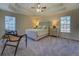 Large main bedroom with tray ceiling, plush carpet, and ensuite bathroom at 1103 Etowah Valley Ln, Woodstock, GA 30189