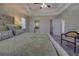 Main bedroom featuring a king-size bed, plush carpet, and view of the ensuite bathroom at 1103 Etowah Valley Ln, Woodstock, GA 30189