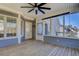 Large screened porch with ceiling fan and wooden floor at 1103 Etowah Valley Ln, Woodstock, GA 30189