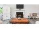 Living room with fireplace, TV, and wooden coffee table at 605 Edgemore Rd, Canton, GA 30114