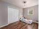 bedroom with hardwood floors and double door closet at 3090 Karen Ne Ln, Marietta, GA 30062
