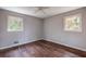 Bright bedroom with hardwood floors and two windows at 3090 Karen Ne Ln, Marietta, GA 30062