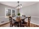 Dining room with hardwood floors and modern light fixture at 3090 Karen Ne Ln, Marietta, GA 30062