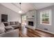 Living room with stone fireplace and hardwood floors, access to deck at 3090 Karen Ne Ln, Marietta, GA 30062