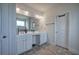 Double vanity bathroom with a large mirror at 96 Wentworth Cir, Villa Rica, GA 30180