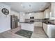 Modern kitchen with white cabinets, granite counters and stainless steel appliances at 96 Wentworth Cir, Villa Rica, GA 30180