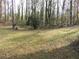 Large backyard with wooded area and grassy lawn at 5426 Martins Crossing Rd, Stone Mountain, GA 30088