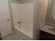 Bathroom with tub and shower, wood vanity at 5426 Martins Crossing Rd, Stone Mountain, GA 30088