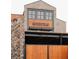 Exterior of a building with brick facade and wooden gate at 556 Sawnee Village Blvd # D76, Cumming, GA 30040