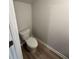 Simple half bathroom with a toilet and flooring at 7240 Crestside Dr # 78, Austell, GA 30168