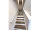 Modern staircase with wood-look treads and white railings at 7262 Crestside Dr # 67, Austell, GA 30168