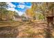 Backyard with trees, a deck, and a playset at 125 Steeplechase Dr, Mcdonough, GA 30252