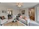 Living room with a view into dining area and access to the bathroom at 1461 Howard Way, Lawrenceville, GA 30043